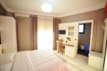 Кровать или кровати в номере Iliria Internacional Hotel