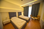 Кровать или кровати в номере Hotel Elesio