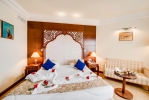 Кровать или кровати в номере Le Royal Hammamet