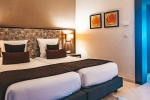 Кровать или кровати в номере Vincci Rosa Beach Monastir