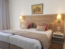 Кровать или кровати в номере Nerolia Hotel & Spa - Families Only