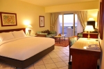 Кровать или кровати в номере Hilton Sharm Waterfalls Resort