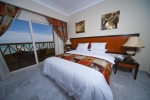 Кровать или кровати в номере AMC Royal Hotel & Spa