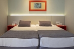 Кровать или кровати в номере Queen's Park Le Jardin