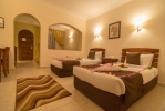 Кровать или кровати в номере Tivoli Hotel Aqua Park
