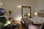 Кровать или кровати в номере Tuvana Hotel