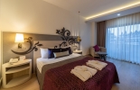 Кровать или кровати в номере Kirman Belazur Resort&Spa
