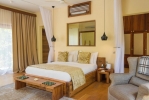 Кровать или кровати в номере Zanzibar White Sand Luxury Villas & Spa - Relais & Chateaux 