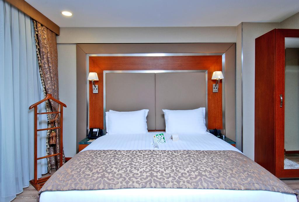 Отель Кровать или кровати в номере Dosso Dossi Hotels Old City 