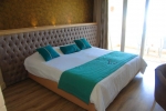 Кровать или кровати в номере Delphin Resort Monastir 