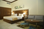 Кровать или кровати в номере Tulip Al Barsha Hotel Apartment 