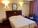 Кровать или кровати в номере Ajman Beach Hotel 