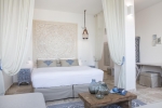 Кровать или кровати в номере Falkensteiner Resort Capo Boi