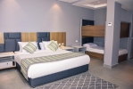 Кровать или кровати в номере Sunrise Diamond Beach Resort