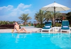 Бассейн в Fujairah Rotana Resort & Spa - Al Aqah Beach или поблизости