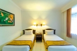 Кровать или кровати в номере Bali Summer Hotel