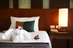 Кровать или кровати в номере Baan Karonburi Resort