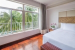 Кровать или кровати в номере Huayu Resort & Spa Yalong Bay Sanya