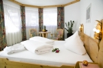 Кровать или кровати в номере Hotel Garni Maria Theresia