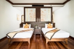 Кровать или кровати в номере Alpina Phuket Nalina Resort & Spa