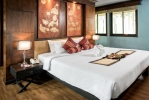 Кровать или кровати в номере Alpina Phuket Nalina Resort & Spa