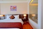 Кровать или кровати в номере Dessole Beach Resort Nha Trang
