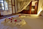 Кровать или кровати в номере Mangrove Lodge