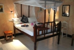 Кровать или кровати в номере La Madrugada Beach Hotel & Resort