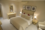 Кровать или кровати в номере Umm Al Quwain Beach Hotel