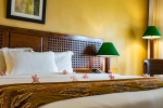 Кровать или кровати в номере Aanari Hotel & Spa