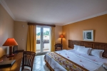 Кровать или кровати в номере Aanari Hotel & Spa