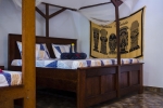 Кровать или кровати в номере Highland Bungalows