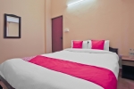 Кровать или кровати в номере OYO Flagship 19721 Prazeres Resort