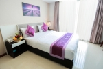 Кровать или кровати в номере Lavender Nha Trang Hotel