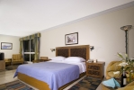 Кровать или кровати в номере Maritim Jolie Ville Resort & Casino