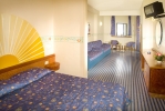 Кровать или кровати в номере Sporting Baia Hotel