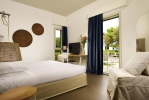 Кровать или кровати в номере UNAHOTELS Naxos Beach Sicilia
