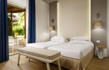 Кровать или кровати в номере UNAHOTELS Naxos Beach Sicilia