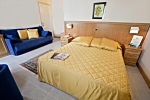 Кровать или кровати в номере Hotel Sabbie d'Oro