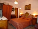 Кровать или кровати в номере Hotel La Riva