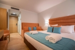 Кровать или кровати в номере Galaxy Hotel; BW Premier Collection