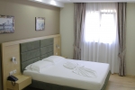 Кровать или кровати в номере Hotel Dyrrah