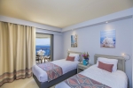 Кровать или кровати в номере Sunrise Holidays Resort (Adults Only)
