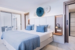 Кровать или кровати в номере Iberostar Selection Playa de Muro Village