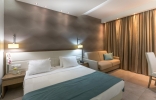 Кровать или кровати в номере Cosmopolitan Hotel & Spa