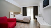 Кровать или кровати в номере Olympus Thalassea Hotel