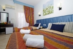 Кровать или кровати в номере Hotel Olympus