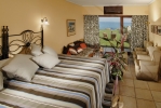 Кровать или кровати в номере Aquila Rithymna Beach