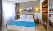 Кровать или кровати в номере Grand Park Lara Hotel