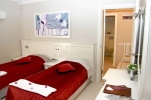 Кровать или кровати в номере Savk Hotel